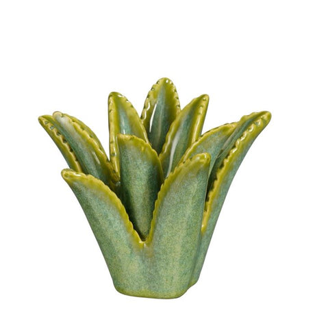 Grønn lysestake formet som en aloe vera-plante.