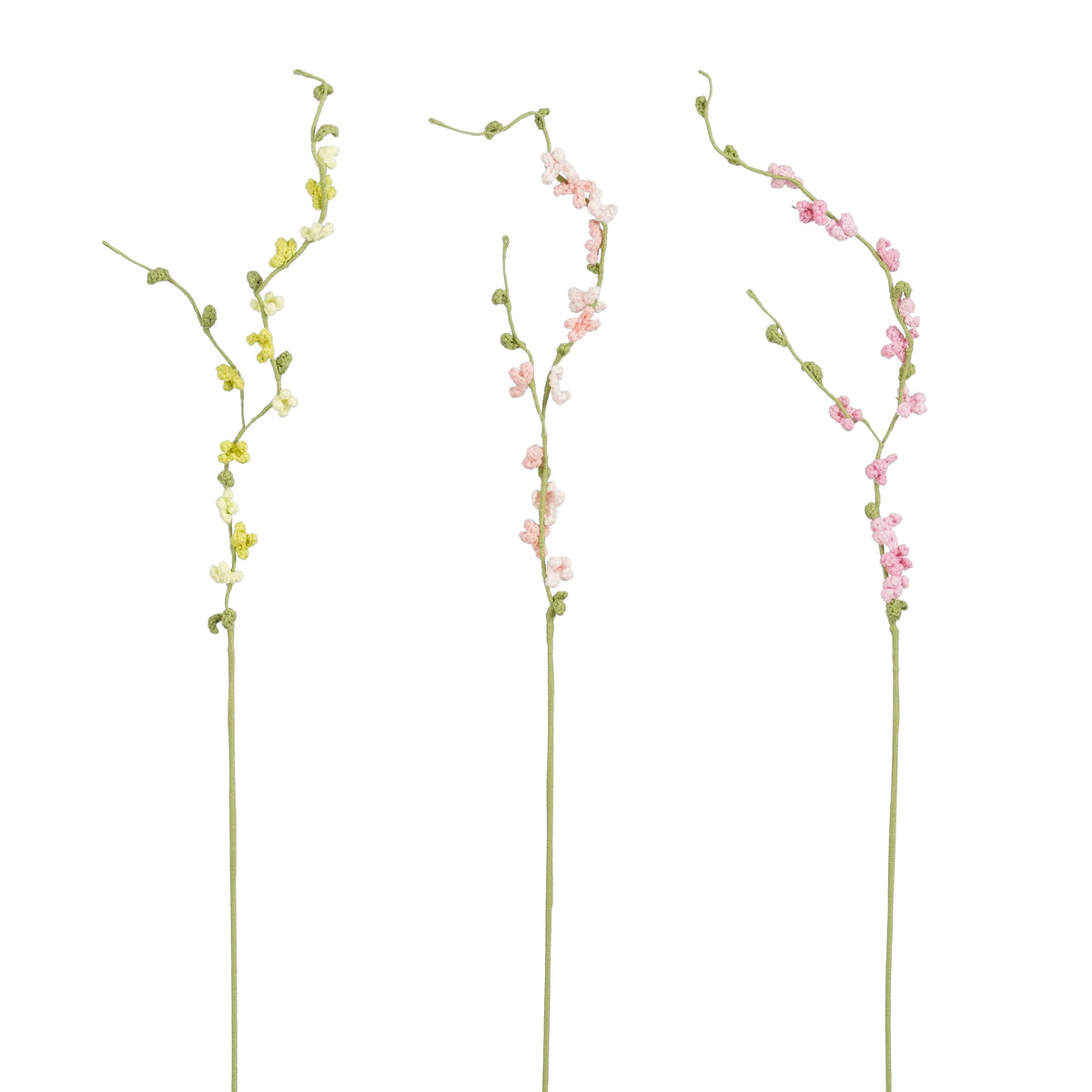 Heklete blomstergrener med små blomster i gul, lys rosa og mørk rosa og grønne knopper